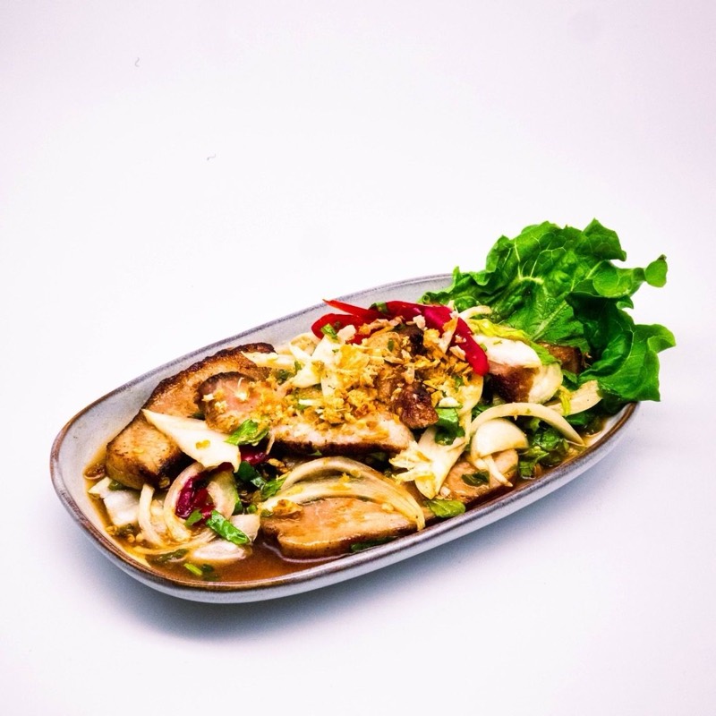 Grilled pork jowl in a chilli-lime salad